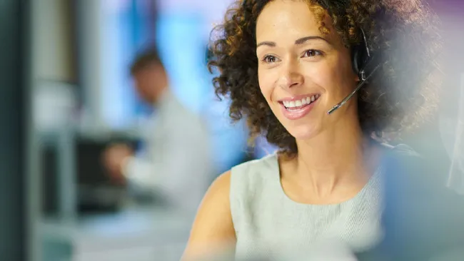 Associate speaking to custom through headset